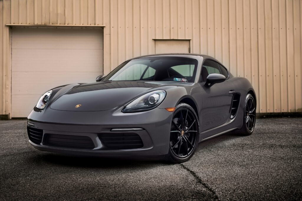 grey porsche outside garage